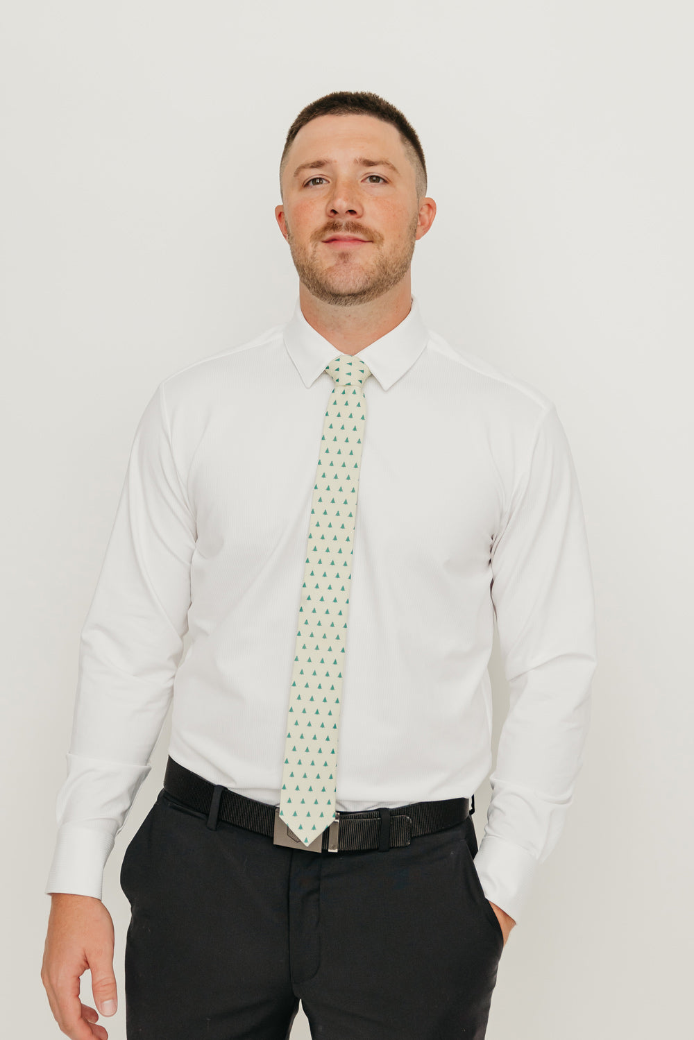 Pine 2.5" Wide Skinny Tie worn with a white shirt, black belt and black suit pants.