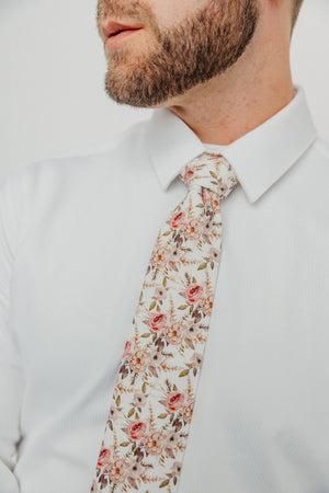 Quicksand Roses tie worn with a white shirt.