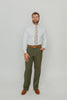 Quicksand Roses tie worn with a white shirt, brown belt and olive green pants.