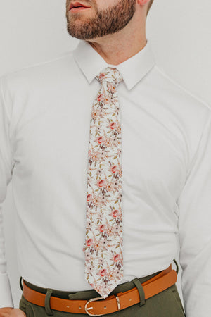 Quicksand Roses tie worn with a white shirt, brown belt and olive green pants.