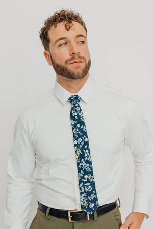 Rio tie worn with a white shirt, black belt and olive green pants.