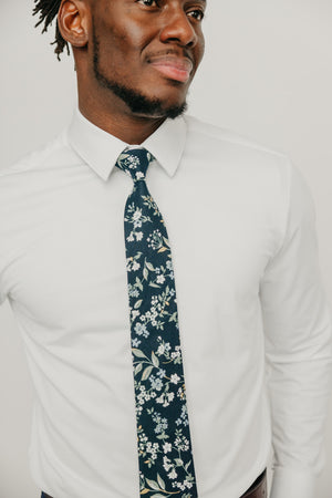 Rio tie worn with a white shirt.
