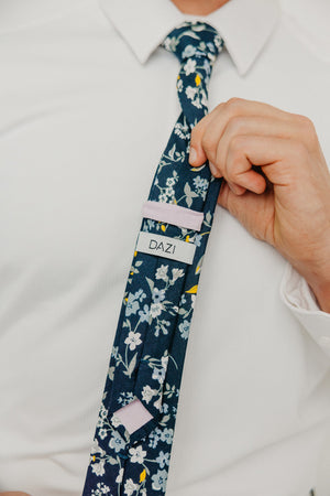 Rio tie worn with a white shirt.
