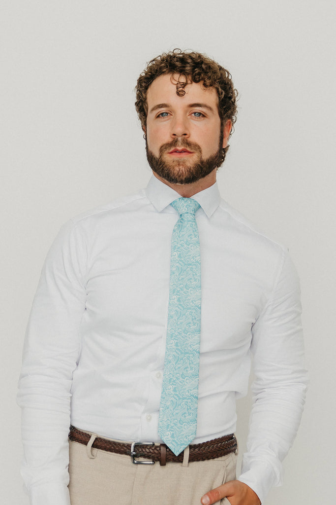 Riptide 3" Wide Standard Tie worn with a white shirt, brown belt and tan suit pants.