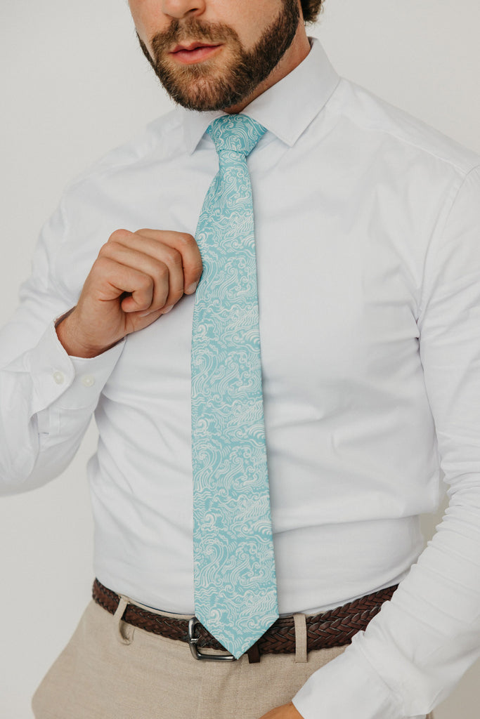Riptide 3" Wide Standard Tie worn with a white shirt, brown belt and tan suit pants.