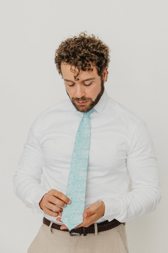 Riptide 3" Wide Standard Tie worn with a white shirt, brown belt and tan suit pants.