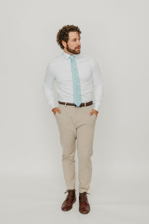 Riptide 3" Wide Standard Tie worn with a white shirt, brown belt and tan suit pants.