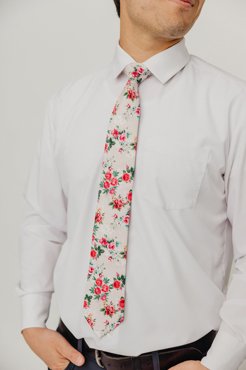 Rose Garden 3" Wide Standard Tie worn with a white shirt, black belt and black suit pants.