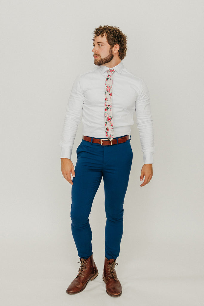 Rose Garden 2.5" Wide Skinny Tie worn with a white shirt, brown belt and royal blue suit pants.
