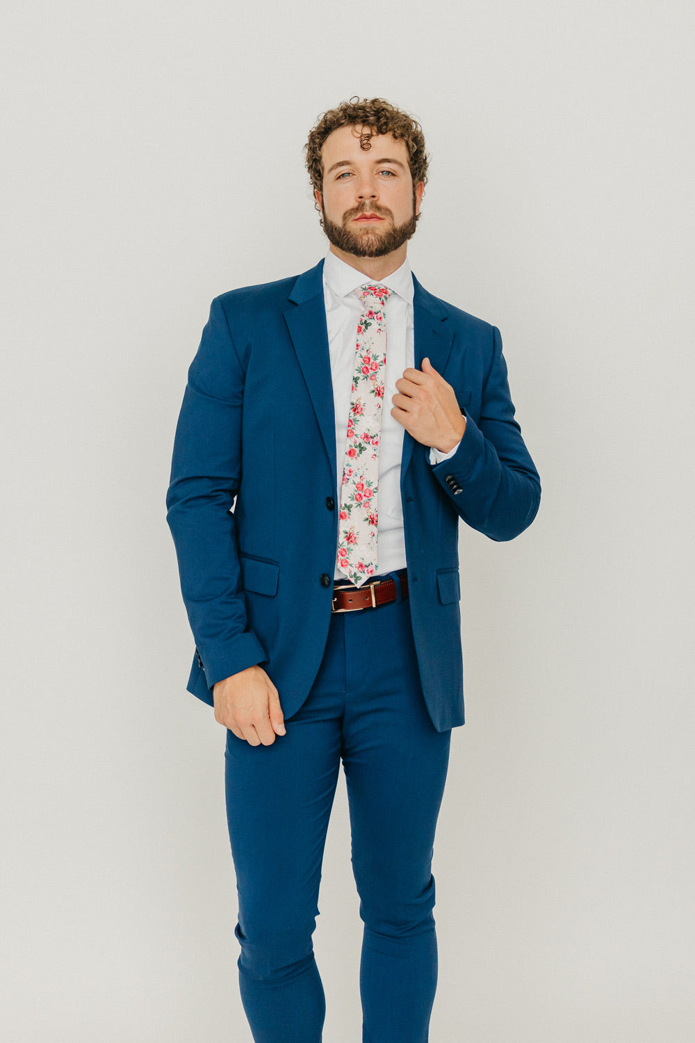 Rose Garden 2.5" Wide Skinny Tie worn with a white shirt, brown belt and royal blue suit.