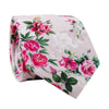 Rose Garden Skinny Tie. Light blush pink background with small pink roses and green leaves.