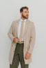 Sand tie worn with a white shirt, brown belt and olive green pants.
