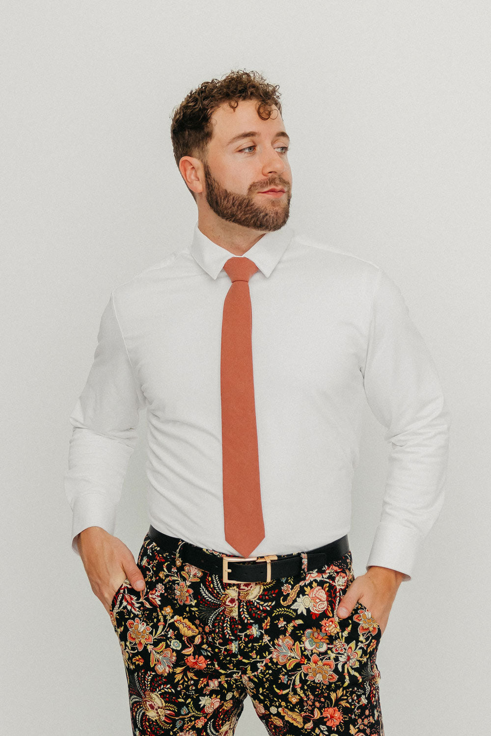 Sedona tie worn with a white shirt, black belt and floral pants.