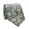 Willow Skinny Tie. Sage mint green background with small orange, yellow, white and green sunflowers and other small flowers and green leaves.