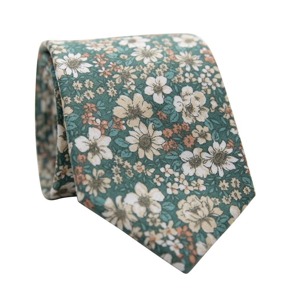 Willow Skinny Tie. Sage mint green background with small orange, yellow, white and green sunflowers and other small flowers and green leaves.