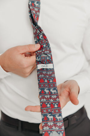 DAZI Winter Wonderland tie worn with a white shirt, black belt and black suit pants.
