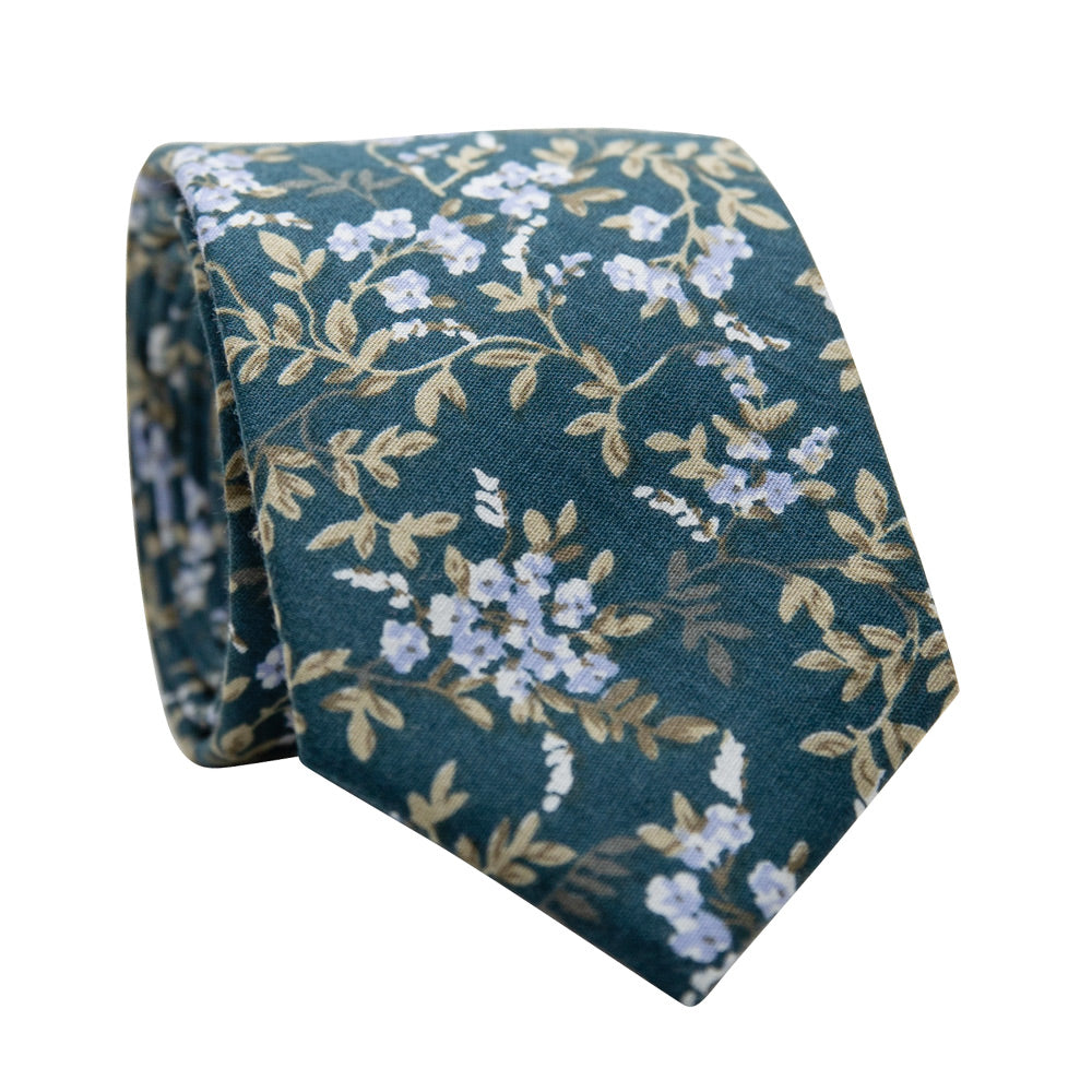Woodland Skinny Tie. Teal green background with small white and light blue flowers and sage green leaves. 
