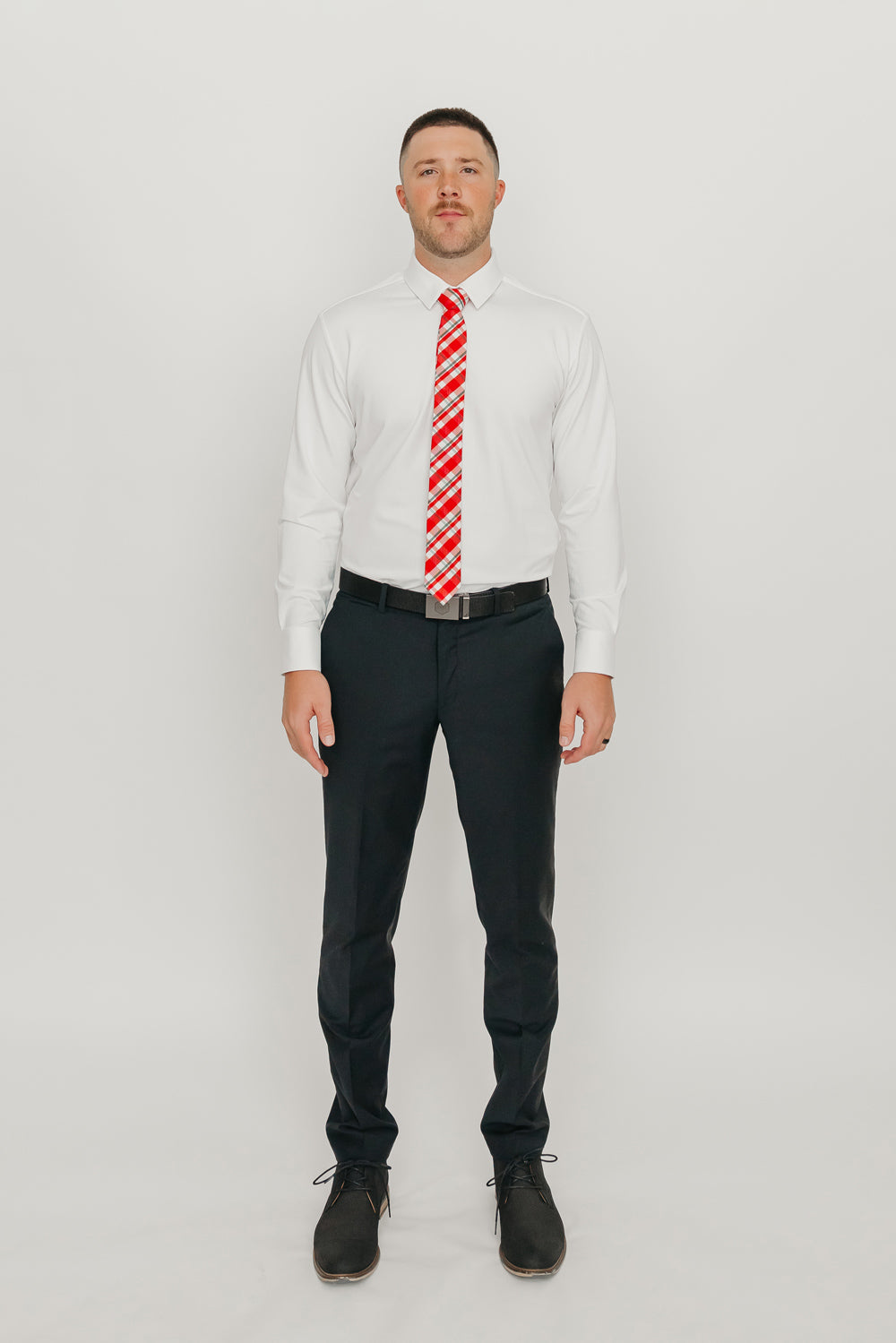 DAZI Wrapped Up Skinny Tie worn with a white shirt, black belt and black suit pants.