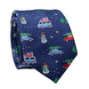 Navy blue tie with Christmas-themed pattern featuring cars, trees, and snowmen on a navy blue background