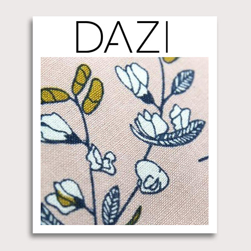 Dusty Lily Fabric Swatch Sample. 3" x 4" fabric sample on cardstock. Light pink background with white and green leaves and flowers, black stems, and some orange accents.