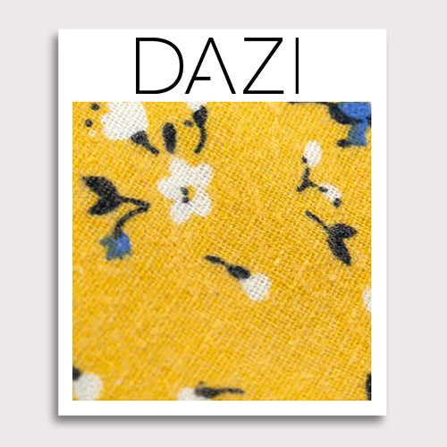 Marigold Fabric Swatch Sample. 3" x 4" fabric sample on cardstock. Yellow background with small white, black and blue flowers.