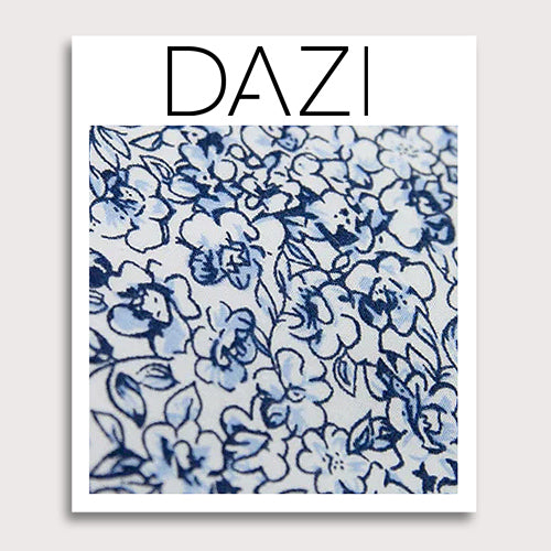 Powder Fabric Swatch Sample. 3" x 4" fabric sample on cardstock. White background with small navy and dusty blue flowers and black stems.