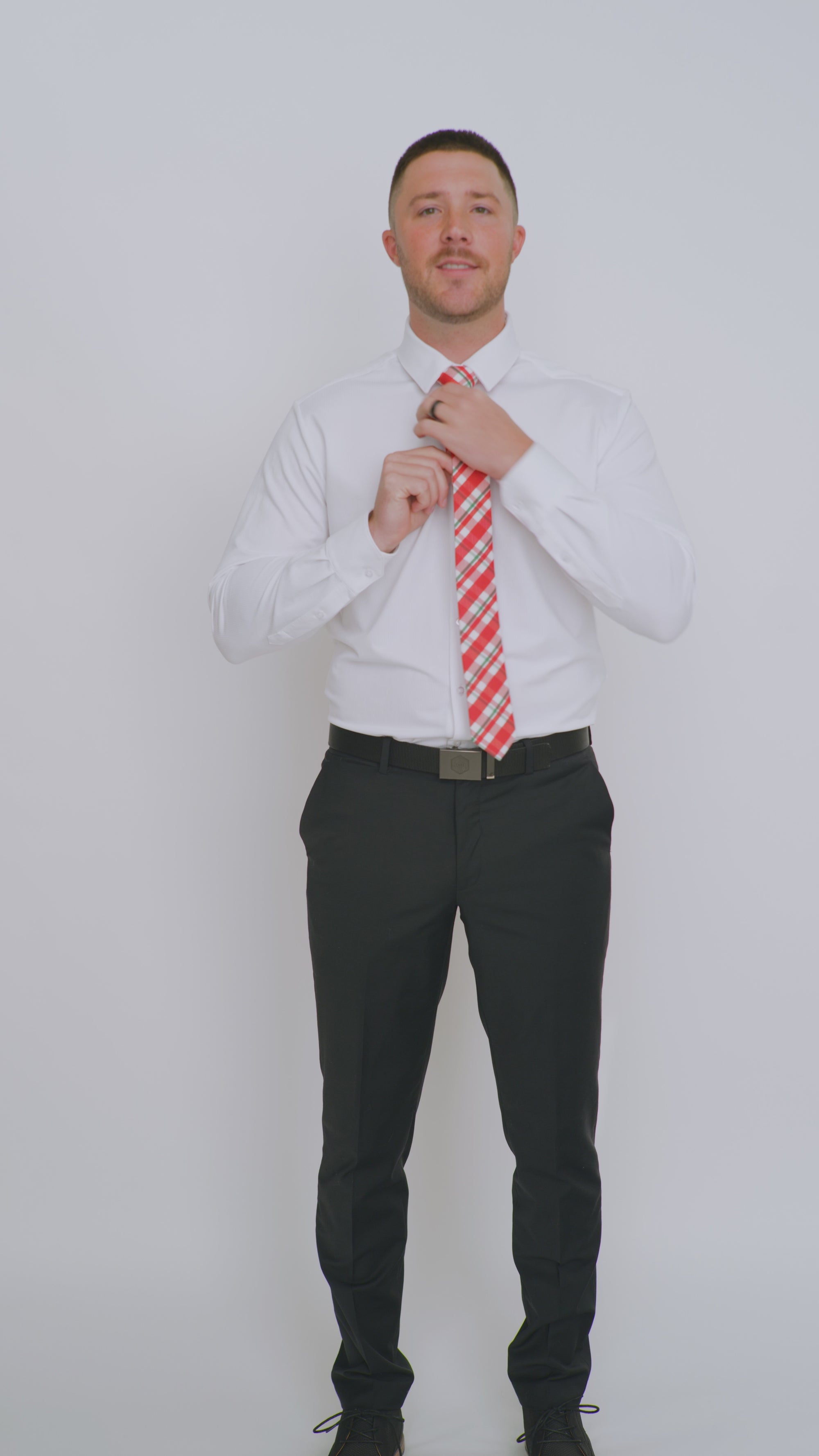 DAZI Wrapped Up Skinny Tie worn with a white shirt, black belt and black suit pants.