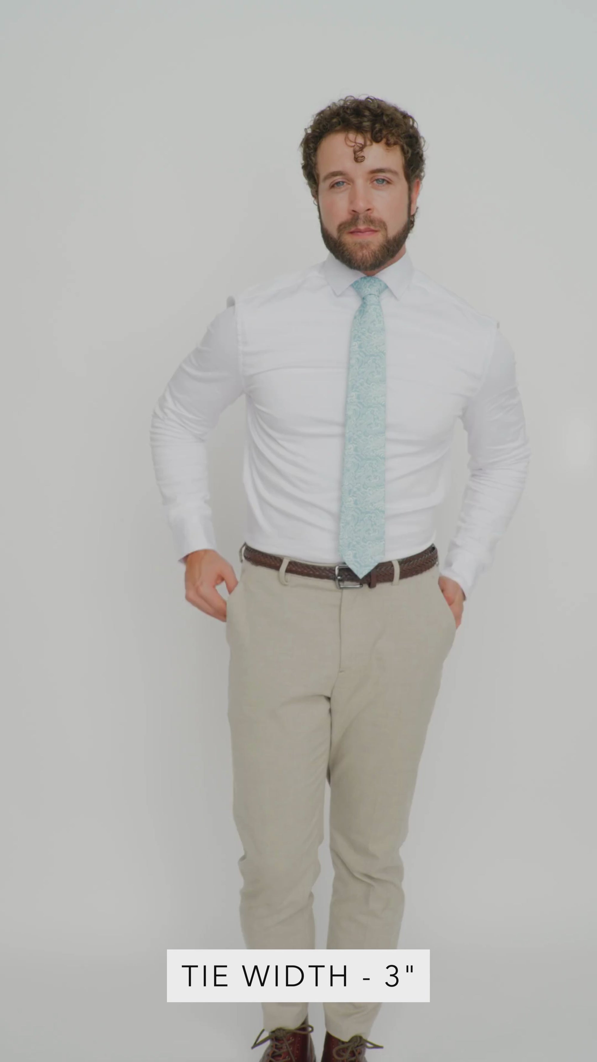 Riptide 3" Wide Standard Tie worn with a white shirt, brown belt and tan suit pants.