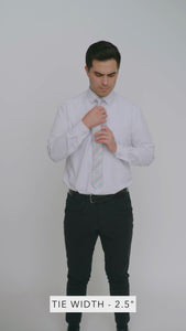 Aztec 2.5" Wide Skinny Tie worn with a white shirt, black belt and black suit pants.