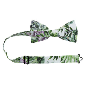 Aloe Pre-Tied Bow Tie with adjustable neck strap. White background with big green succulents and leaves, and also purple succulents.