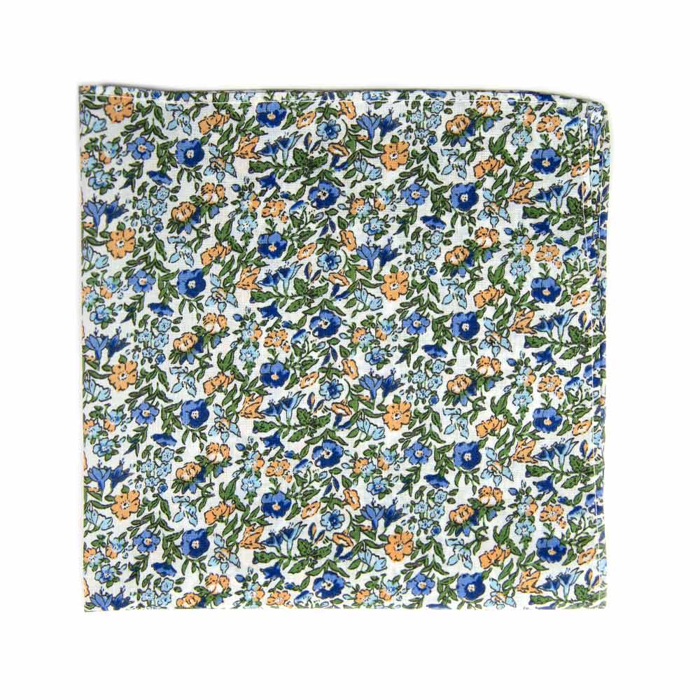 Alpine Blum Pocket Square. White background with small blue and yellow flowers, small green leaves throughout.