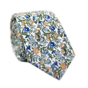 Alpine Blum Skinny Tie. White background with small blue and yellow flowers, small green leaves throughout.