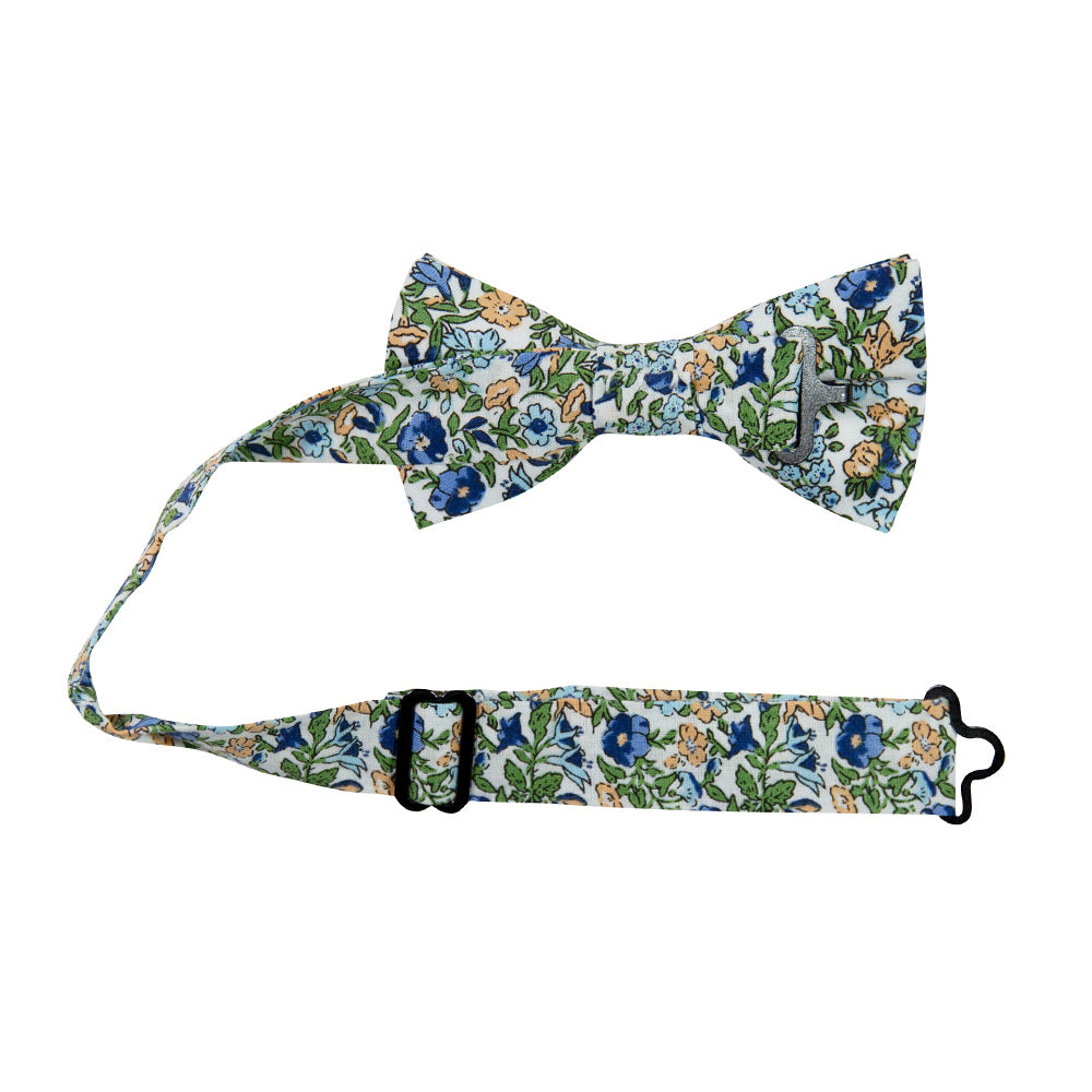 Alpine Blum Pre-Tied Bow Tie with Adjustable Neck Strap. White background with small blue and yellow flowers, small green leaves throughout.