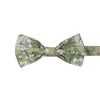 Alyssum Pre-Tied Bow Tie. Light sage green background with medium white flowers and green leaves patterned throughout.