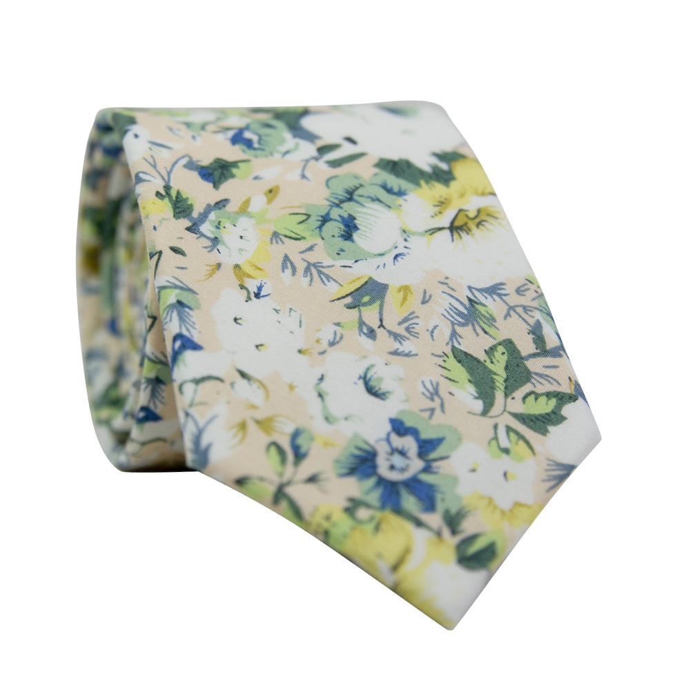 Antiquity Skinny Tie. Off-white cream background with a variety of white, sage green, yellow gold and light navy blue flowers scattered throughout.