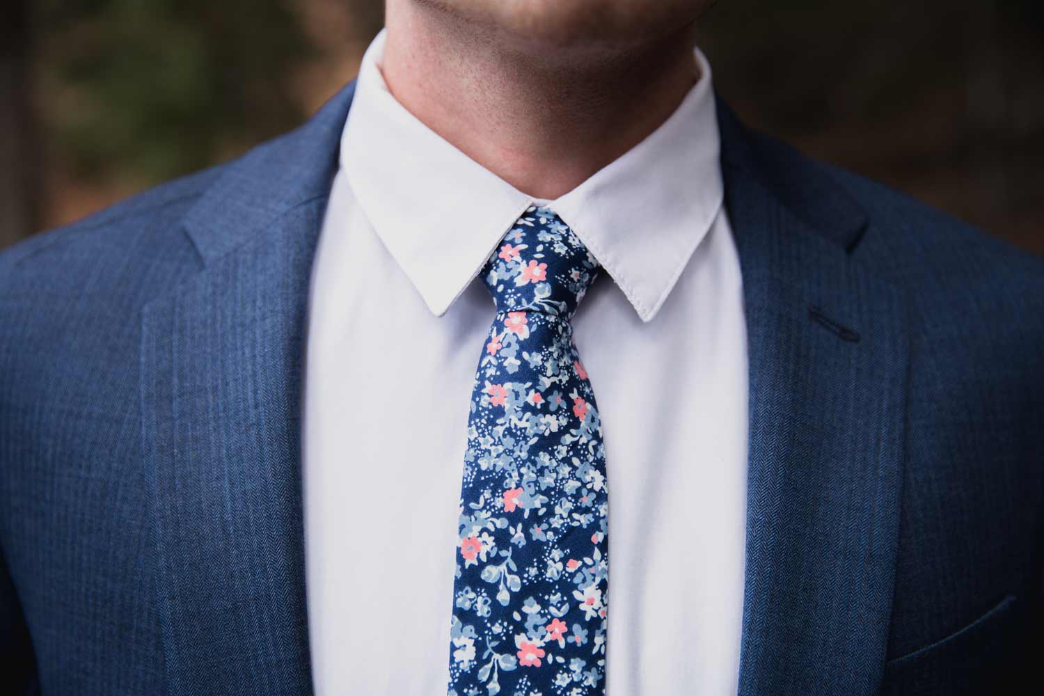 Atlanta tie worn with a white shirt and blue suit jacket. 