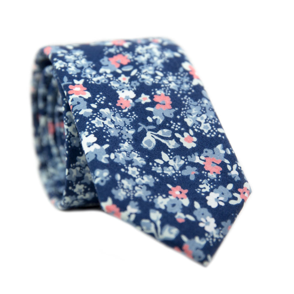 Atlanta Skinny Tie. Navy background with small dusty blue, white, and blush pink flowers.