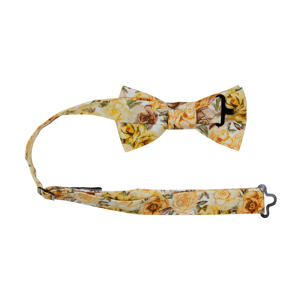 Autumn Cascade Pre-Tied Bow Tie with adjustable neck strap. White background with a tight pattern of yellow gold, orange, and tan brown flowers throughout.