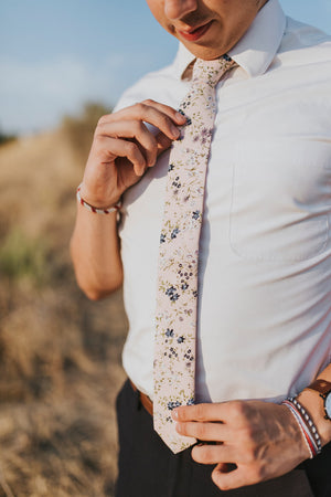 Babys Breath tie worn with a white shirt and black pants.