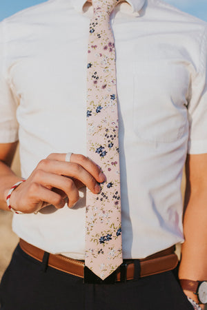 Babys Breath tie worn with a white shirt and black pants.