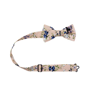 Babys Breath Pre-Tied Bow Tie with adjustable neck strap. Blush background with blue, white and lavender flowers, with green leaves and stems.