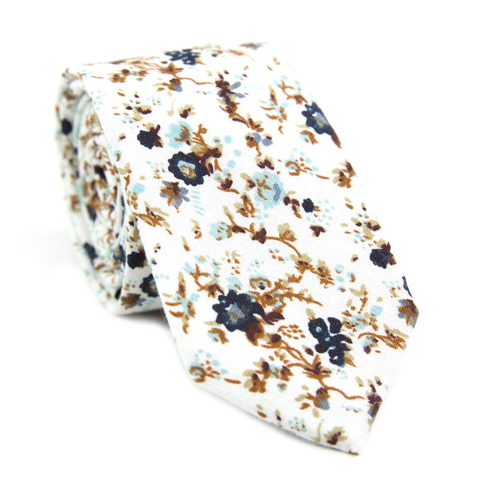 Blue Bloom skinny tie. White background, navy and light blue flowers, brown branches.