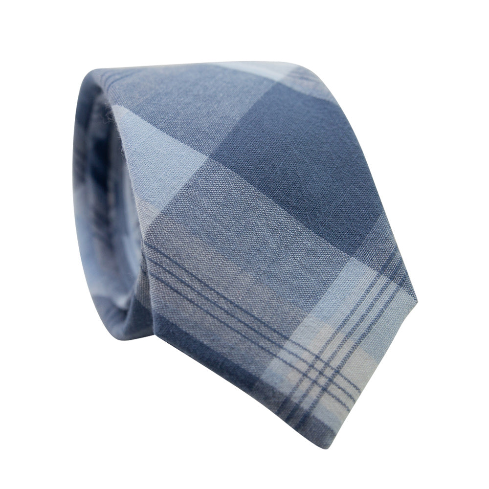 Blue Lagoon Skinny Tie. Plaid pattern with various size stripes of blue and white. 