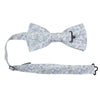Bluebell Pre-Tied Bow Tie with adjustable neck strap. White background with small dusty blue flowers and sage green stems and leaves throughout.