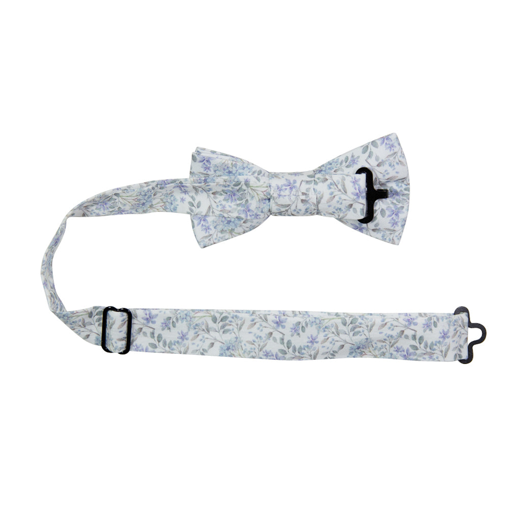 Bluebell Pre-Tied Bow Tie with adjustable neck strap. White background with small dusty blue flowers and sage green stems and leaves throughout.