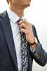 Blueberry Bliss tie worn with white shirt and navy suit jacket.