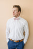 Blush Pre-Tied bow tie worn with a white shirt, brown belt and blue pants. 