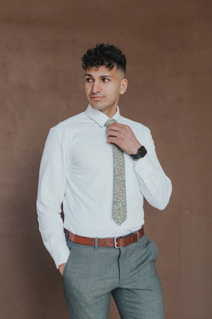 Calla Lily Tie worn with a white shirt, brown belt and gray pants.
