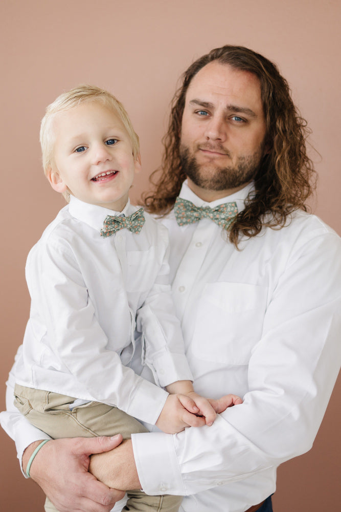 Calla Lily pre-tied bow tie worn by a father and son with a white shirt and tan pants.