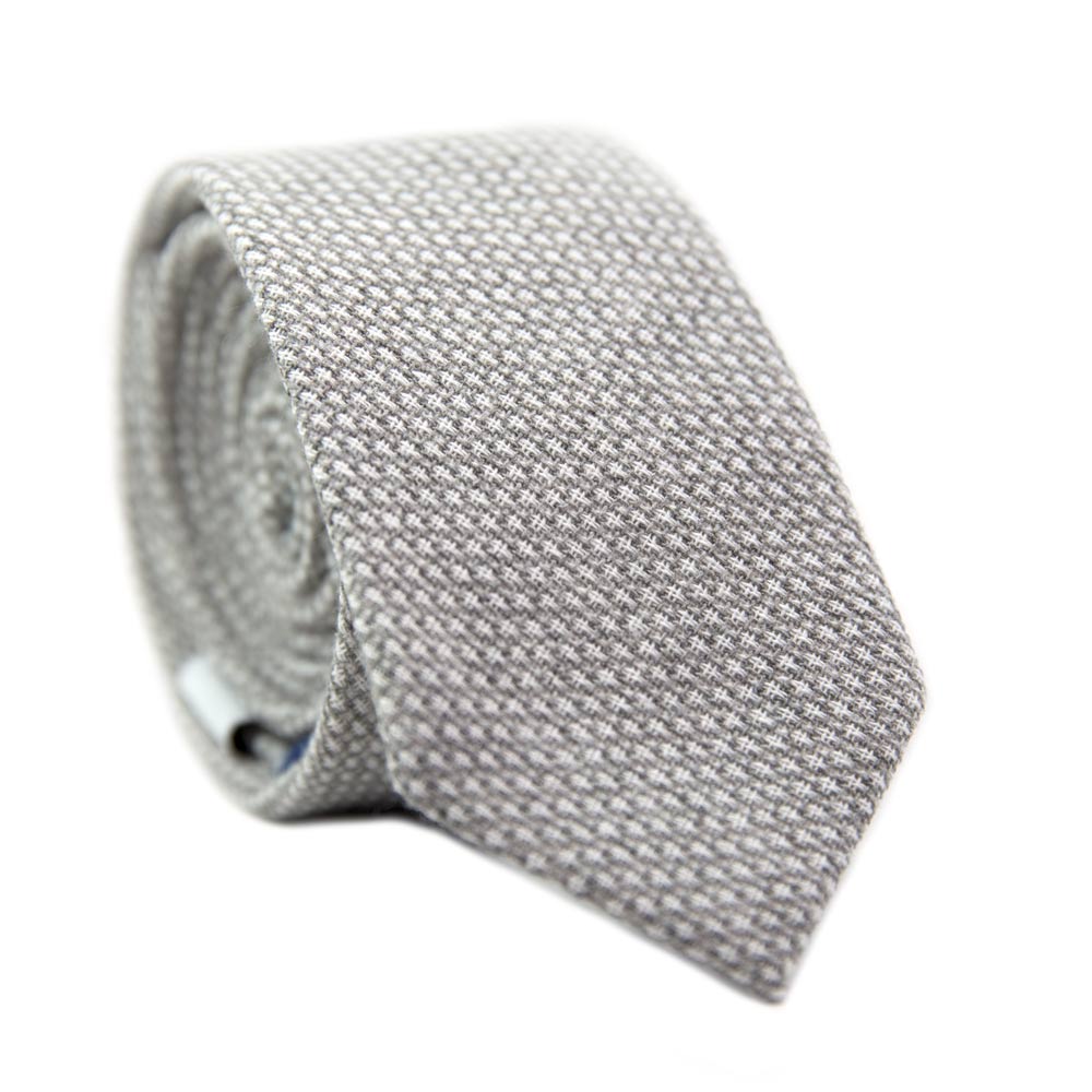 Calm Skinny Tie. Textured gray fabric with small textures of white throughout. 